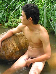 Sexy Thai guy strips in the wild