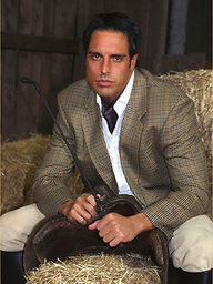 Marcello dressed in full riding suit masturbating in the stables