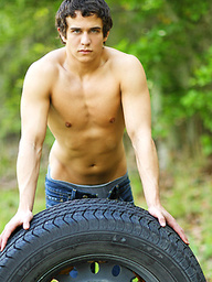 Lusty twink Joel plays with his cock outdoors
