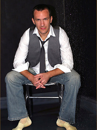 Gay hunk gets too horny and showers in his suit and socks, then pulls his hard cock